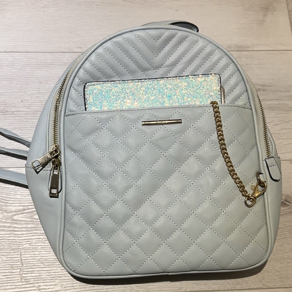 Light and useful Blue Backpack with Sparkle chained Pocket